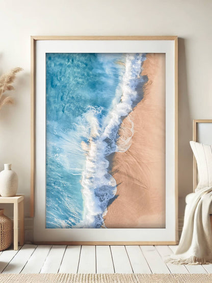 Framed aerial coastal photography print of Bronte Beach shoreline displayed on a wall
