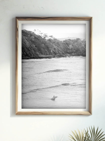 Framed black and white photography print of Wategos Beach Byron Bay displayed on a wall