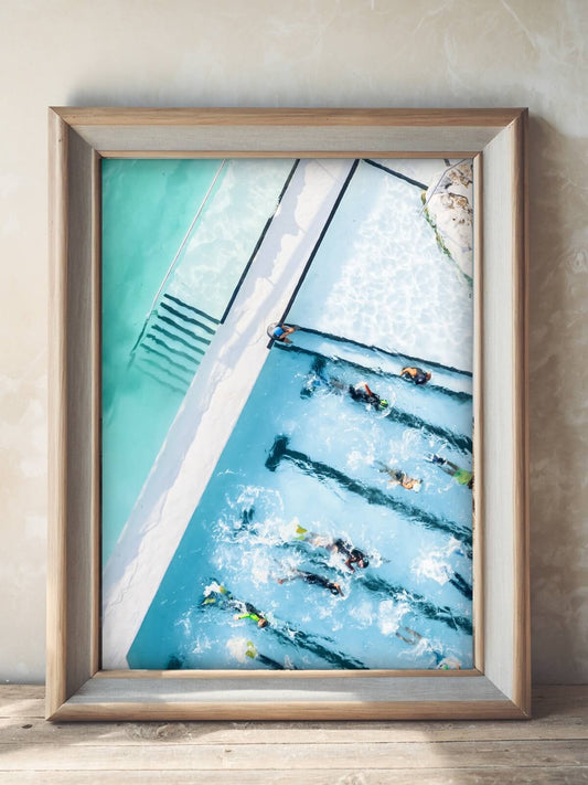 Framed aerial photography print of Bondi Icebergs pool displayed on a wall
