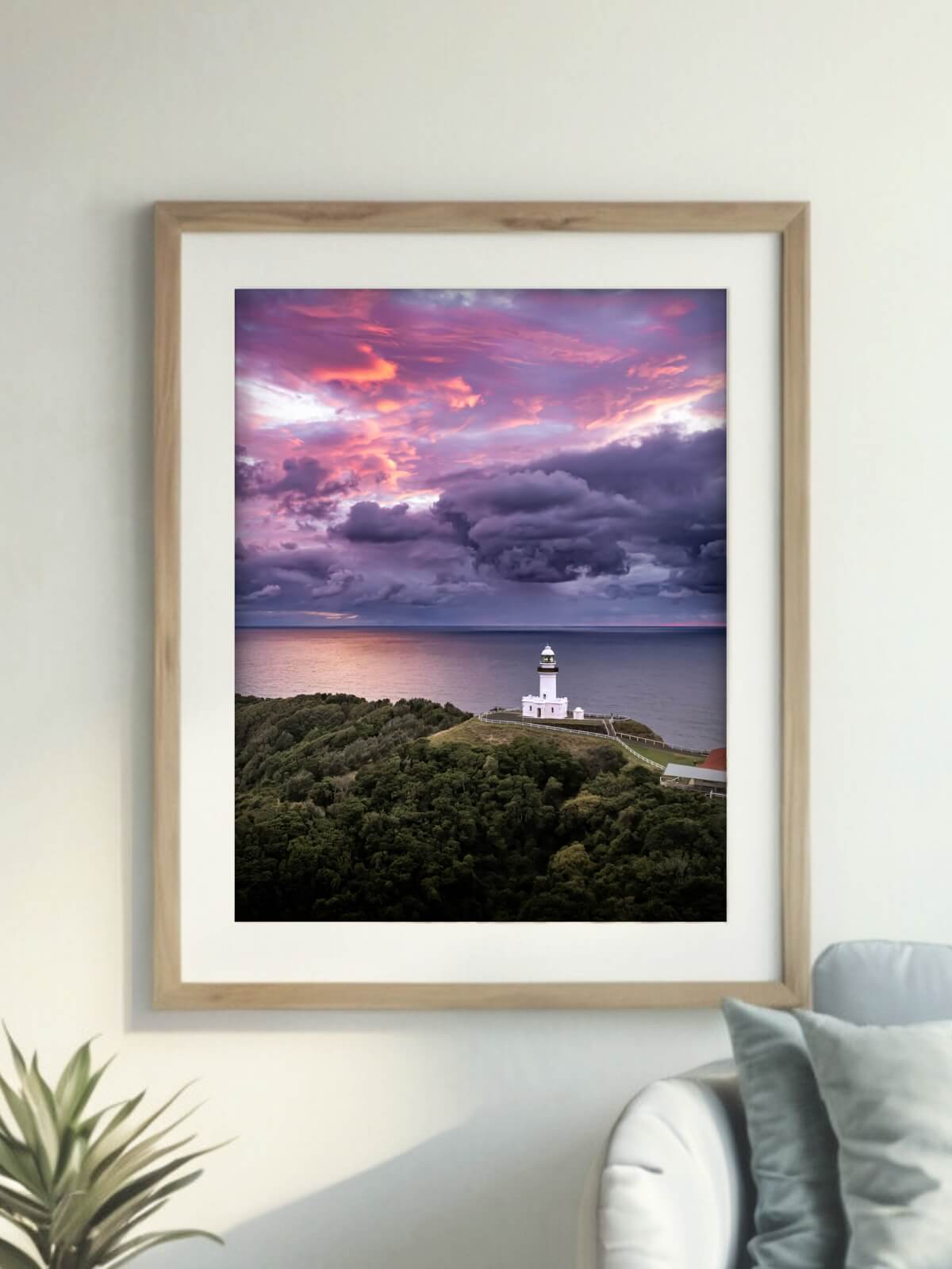 Framed aerial photography print of Cape Byron Lighthouse Byron Bay on a wall