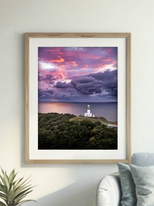 Framed aerial photography print of Cape Byron Lighthouse Byron Bay on a wall