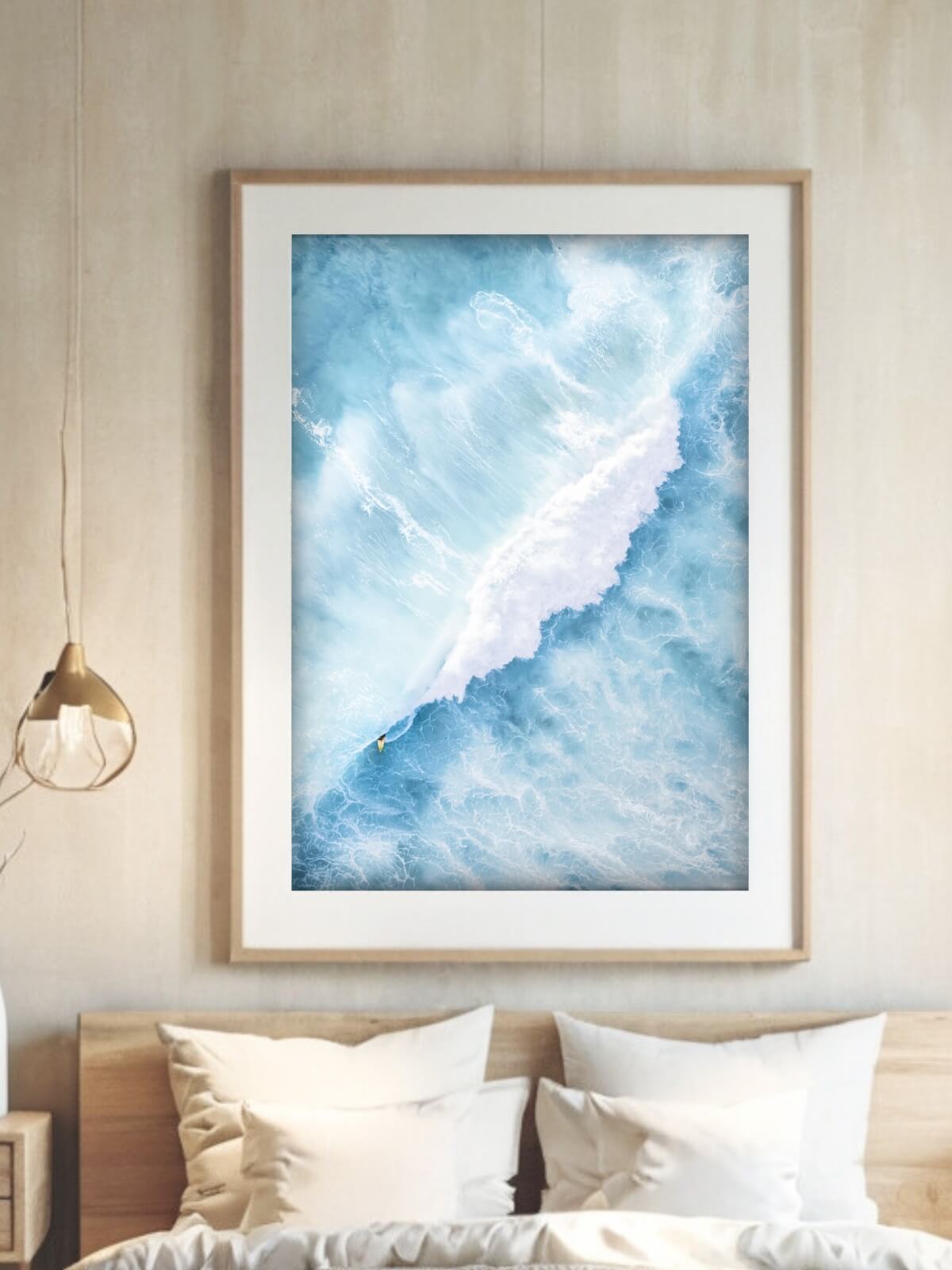 Framed aerial surf photography print of Maroubra Beach displayed in a bedroom