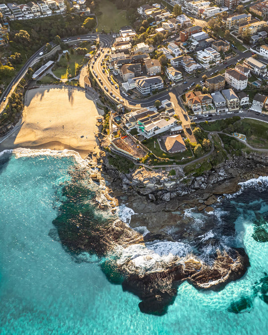 Aerial view of Tamarama Beach Sydney showing the beach, rocky headlands and suburb