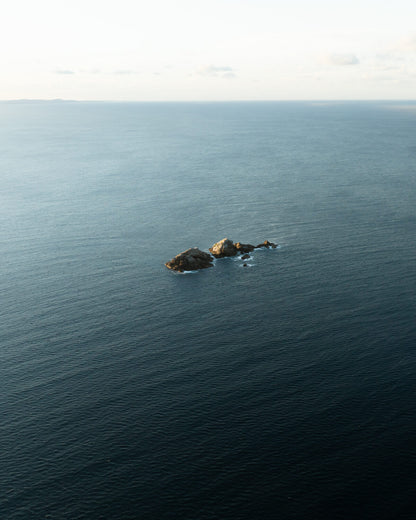 Aerial view of Julian Rocks in the open ocean off Byron Bay, NSW Australia
