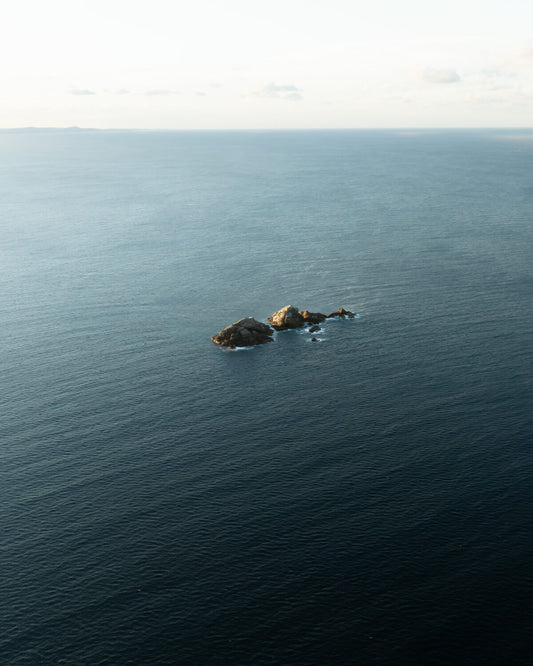 Aerial view of Julian Rocks in the open ocean off Byron Bay, NSW Australia