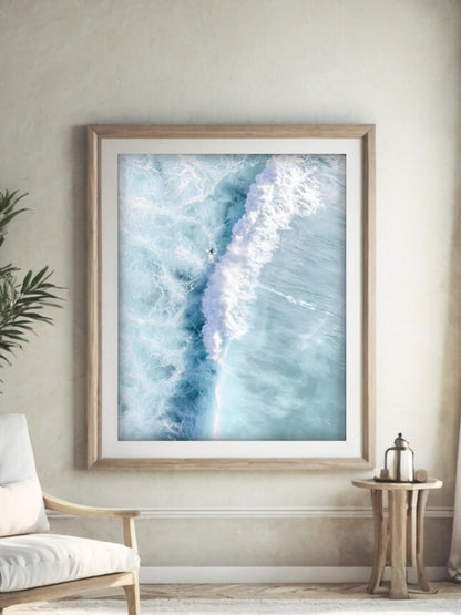 Framed aerial surf photography print of Maroubra Beach displayed in a living room