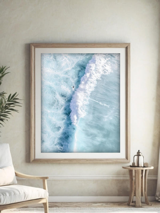 Framed aerial surf photography print of Maroubra Beach displayed in a living room