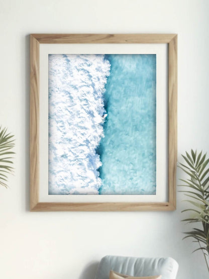 Framed aerial surf photography print of Bronte Beach on a wall