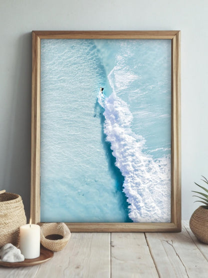Framed aerial surf photography print of The Pass Byron Bay displayed on a wall