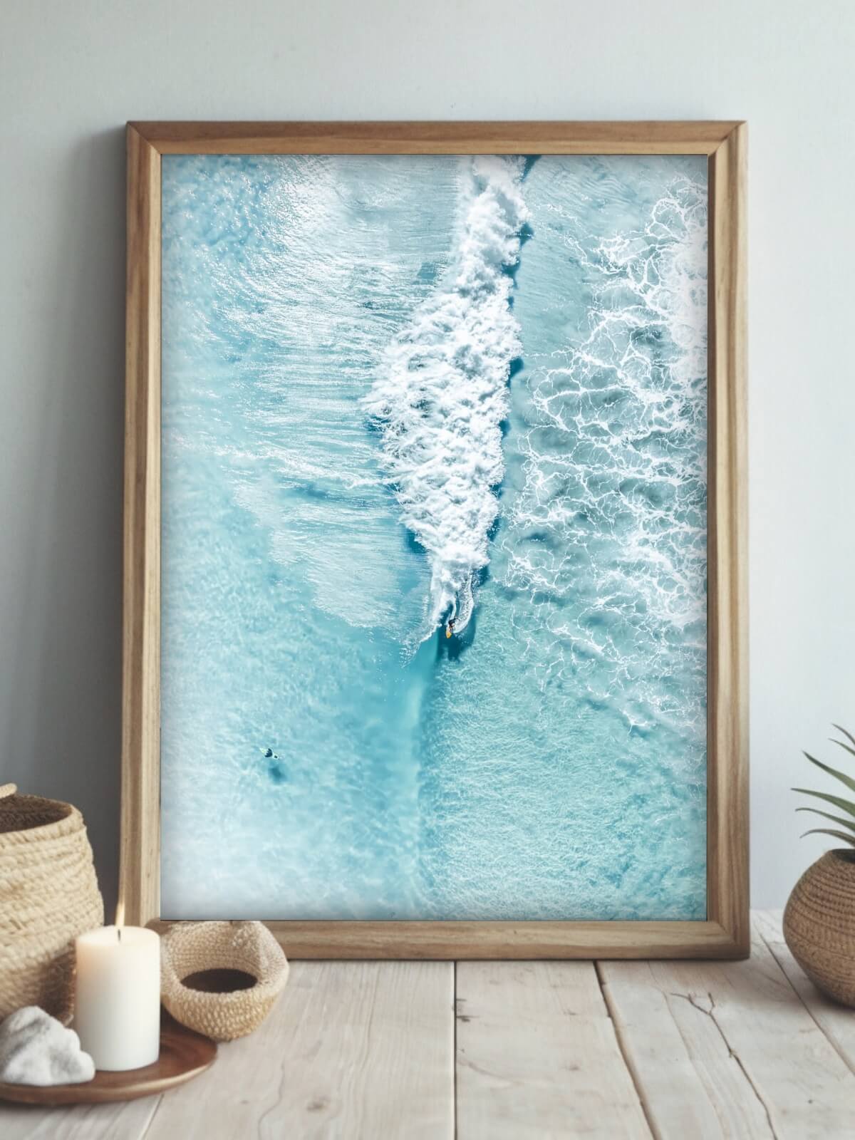 Framed aerial surf photography print of The Pass Byron Bay displayed on a wall