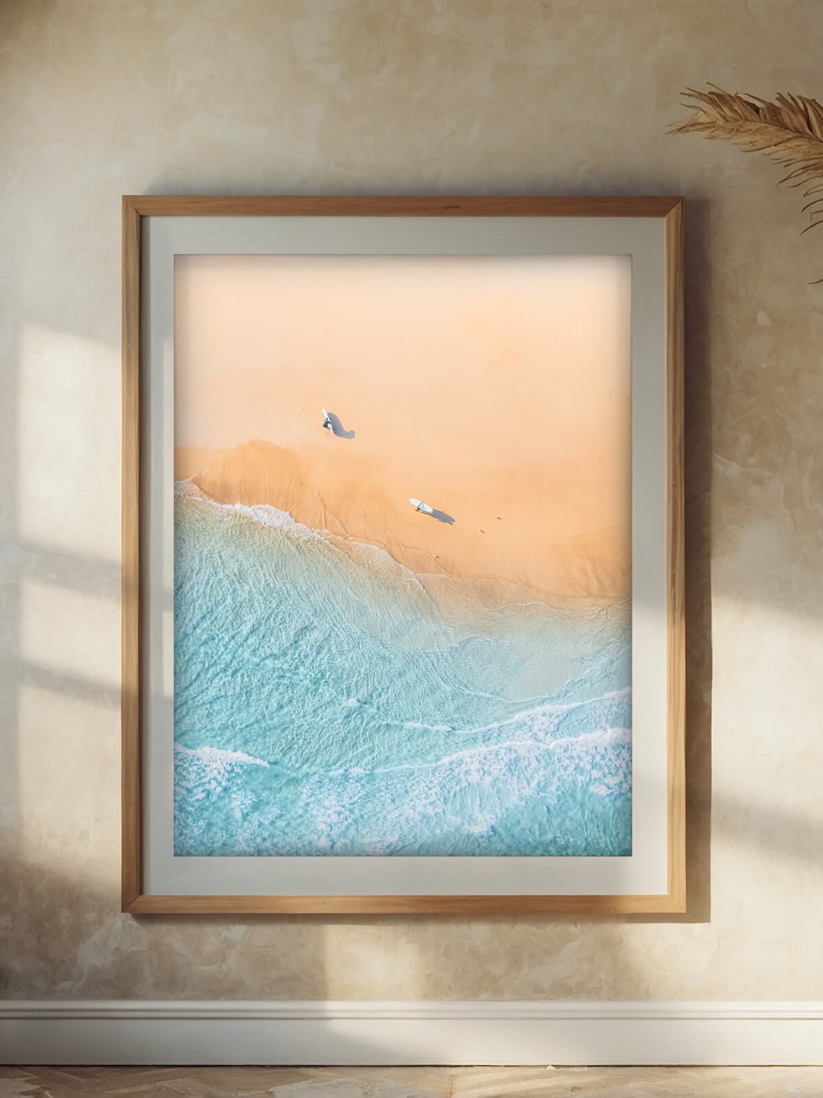Framed aerial surf photography print of The Pass Byron Bay on a wall