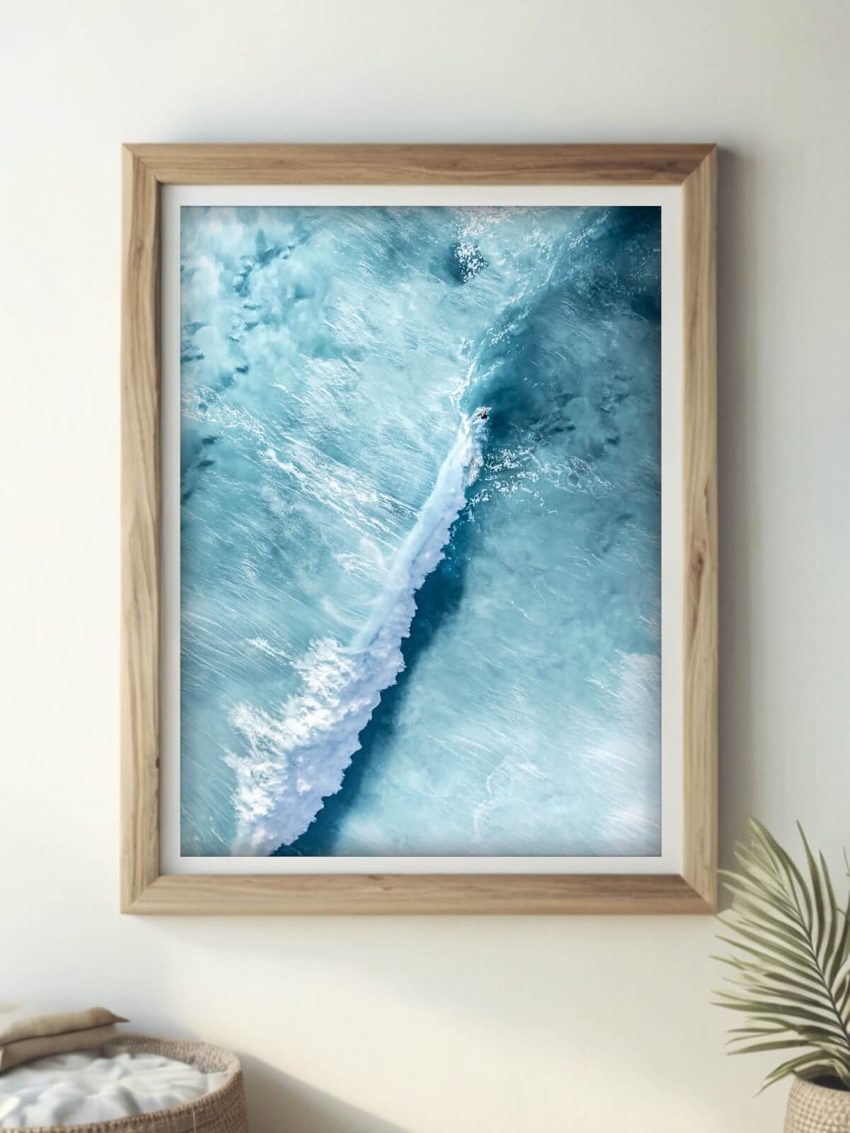 Framed aerial surf photography print of Bronte Beach displayed on a wall