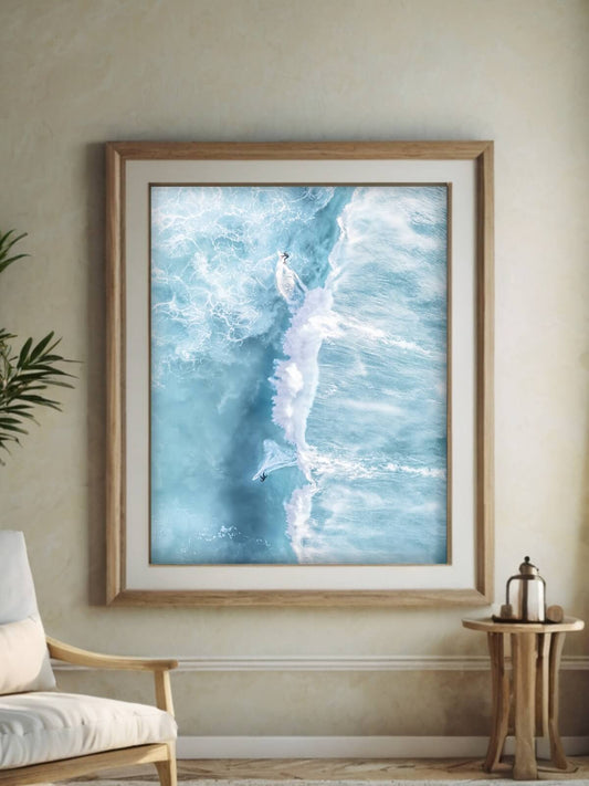 Framed aerial surf photography print of Bronte Beach displayed on a living room wall